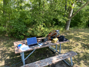 Station setup on the picnic table.